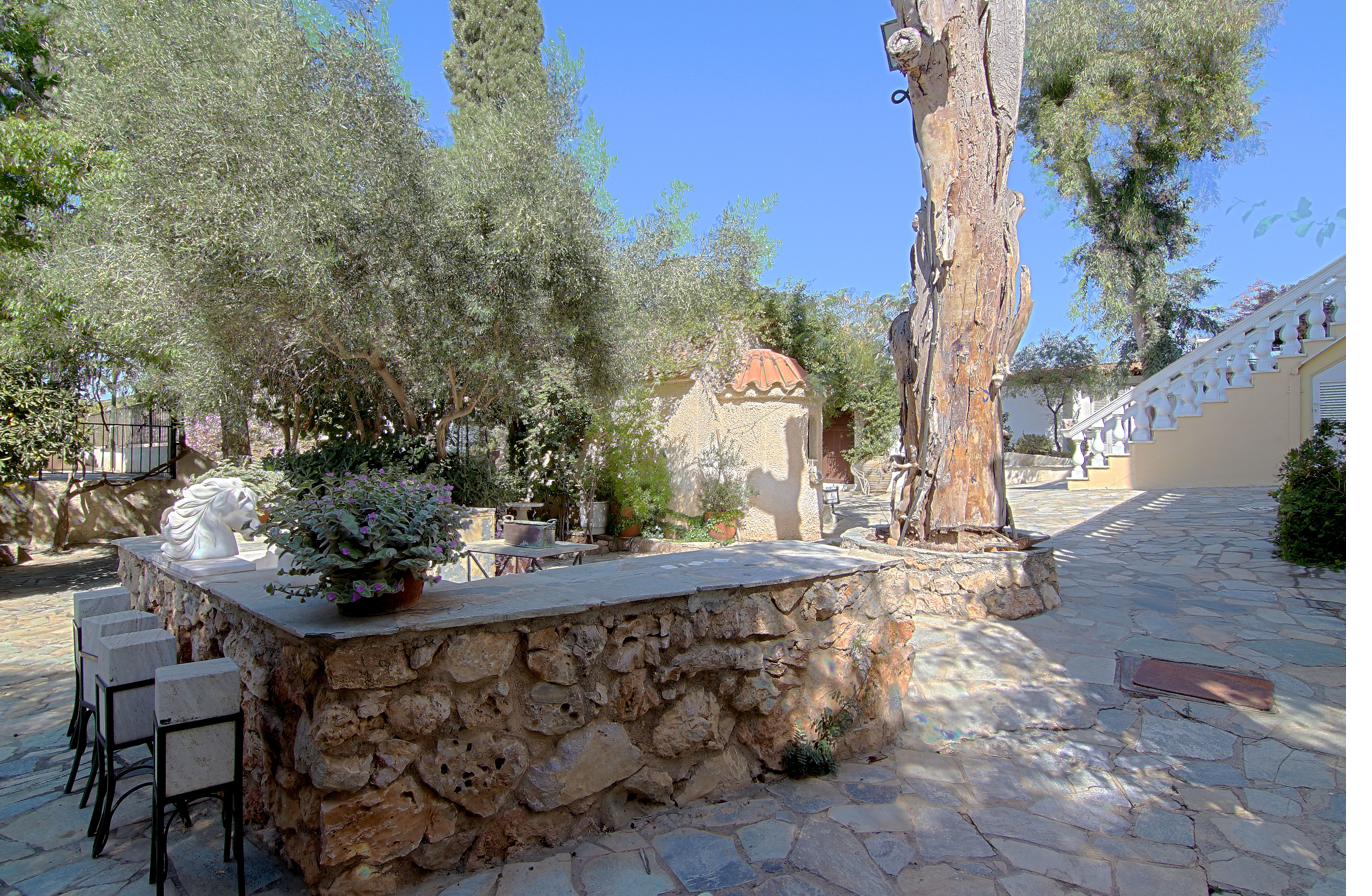 Stone planter and paved garden path